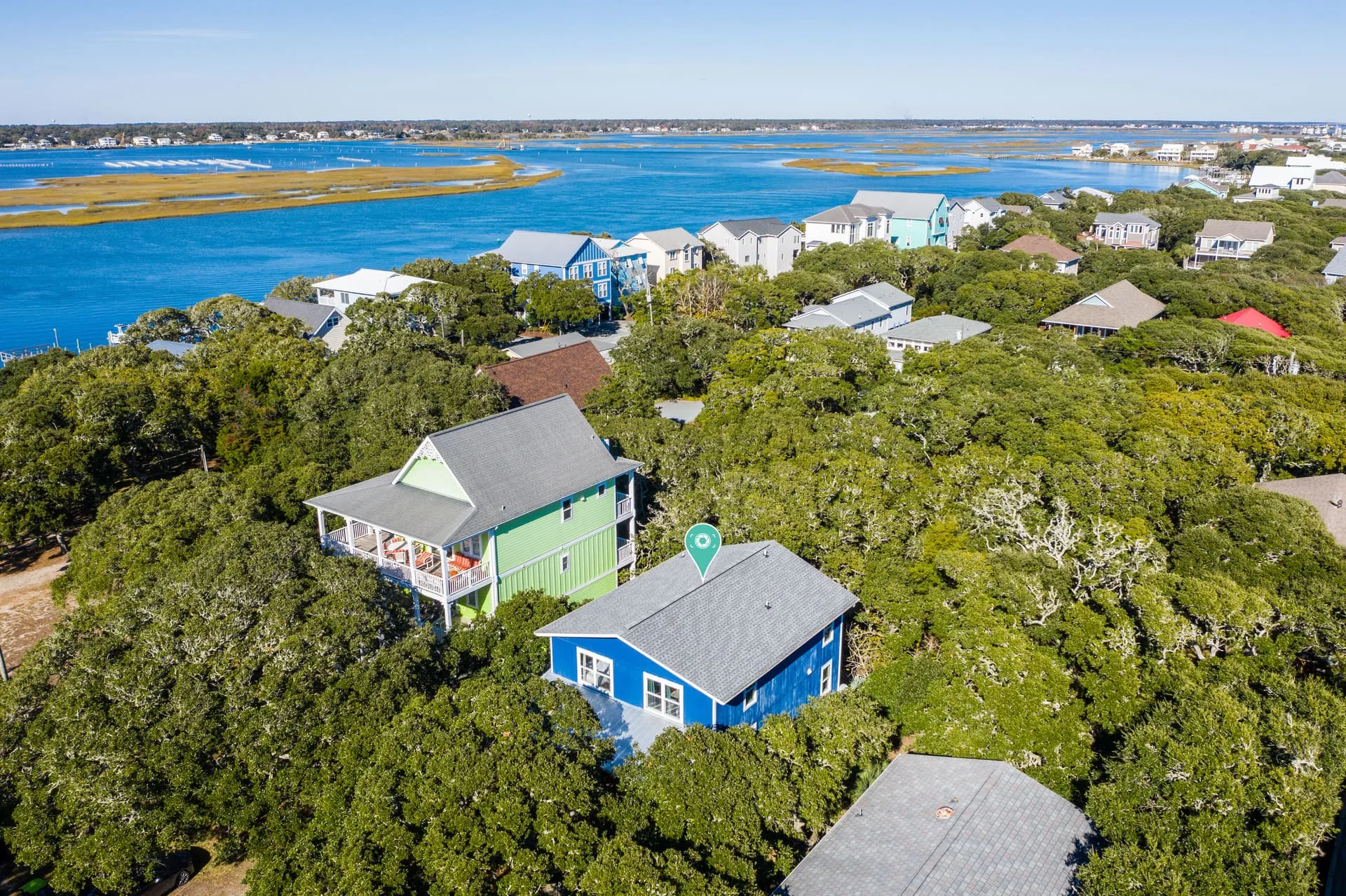 Close aerial of the house with the sound behind