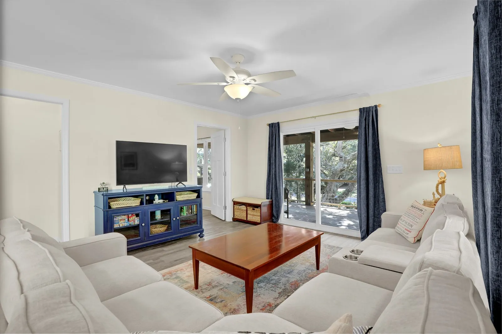 Living area with smart TV and coastal furnishings