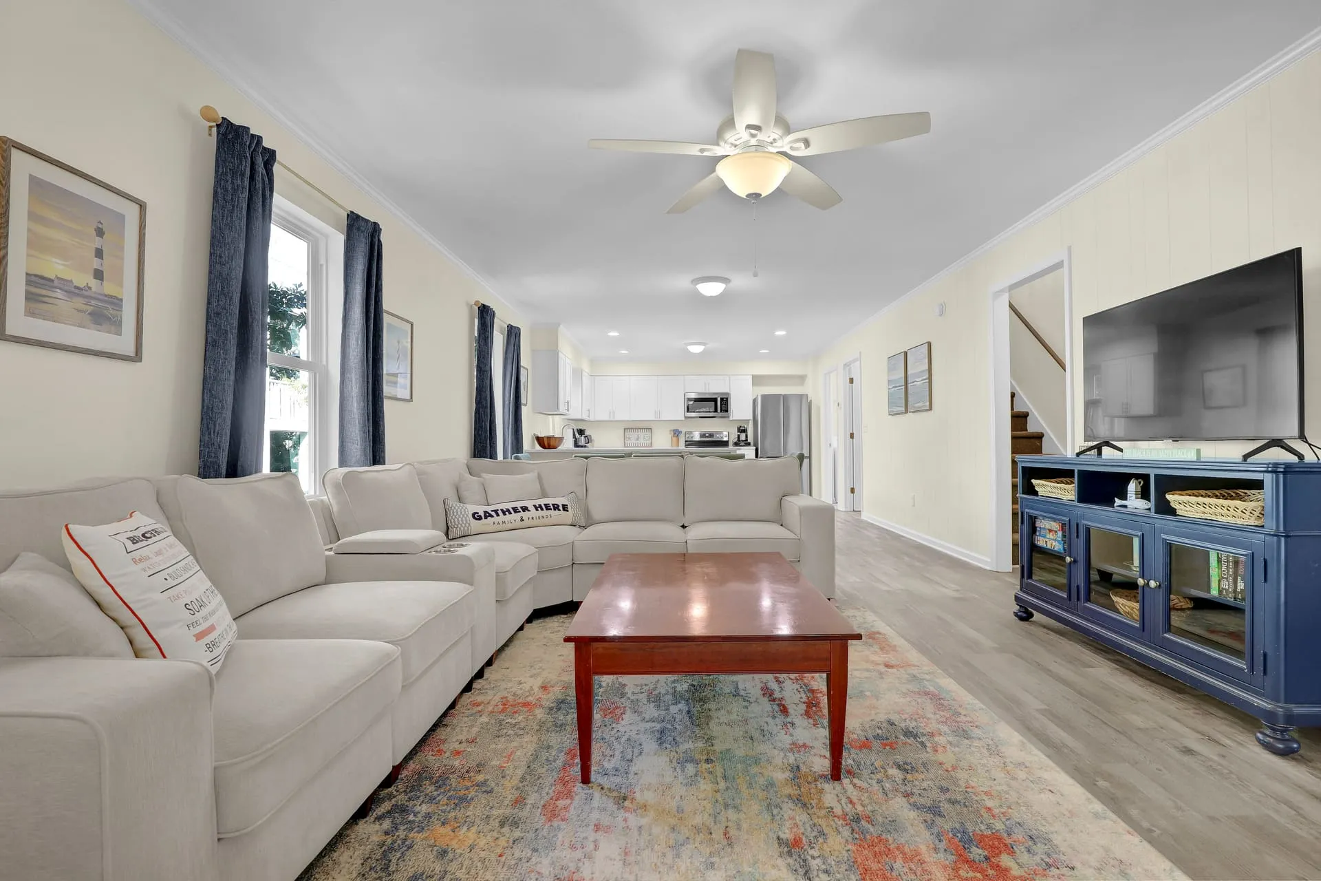 Living room sectional with the open kitchen beyond
