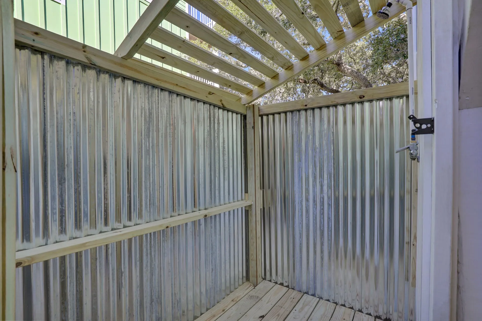 Private outdoor shower with pergola top